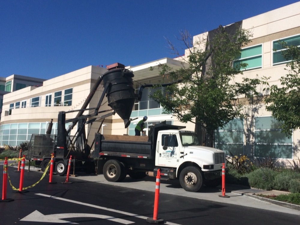 Before rooftop gravel removal