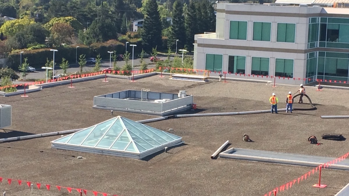 Before rooftop gravel removal